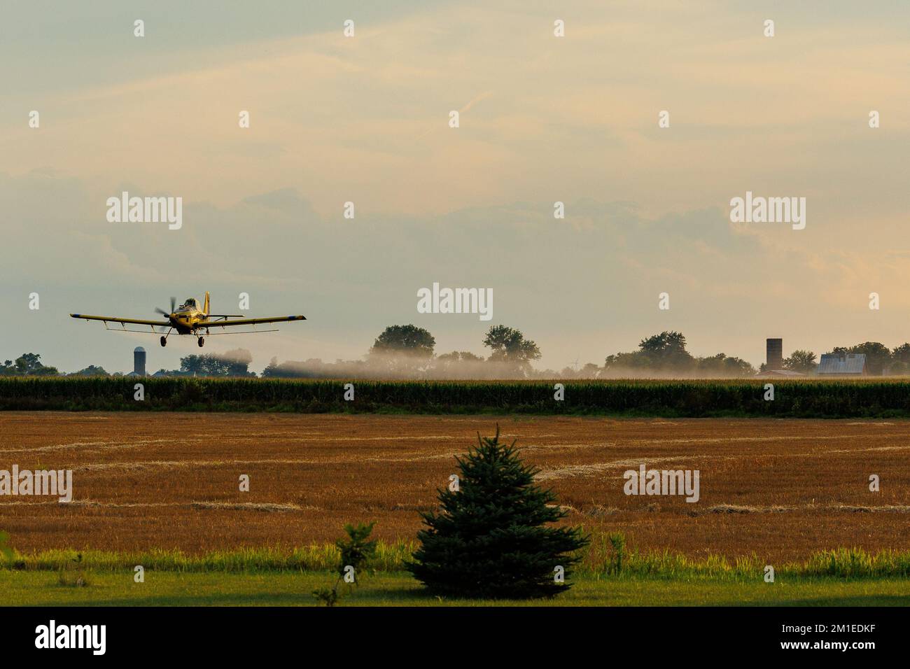 Aerial application by crop plane in rural Illinois Stock Photo
