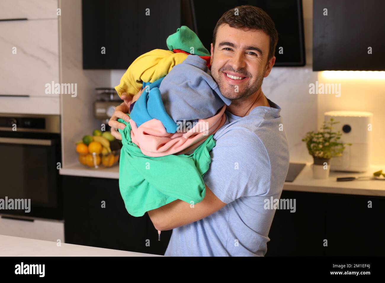 Cute man doing the laundry Stock Photo