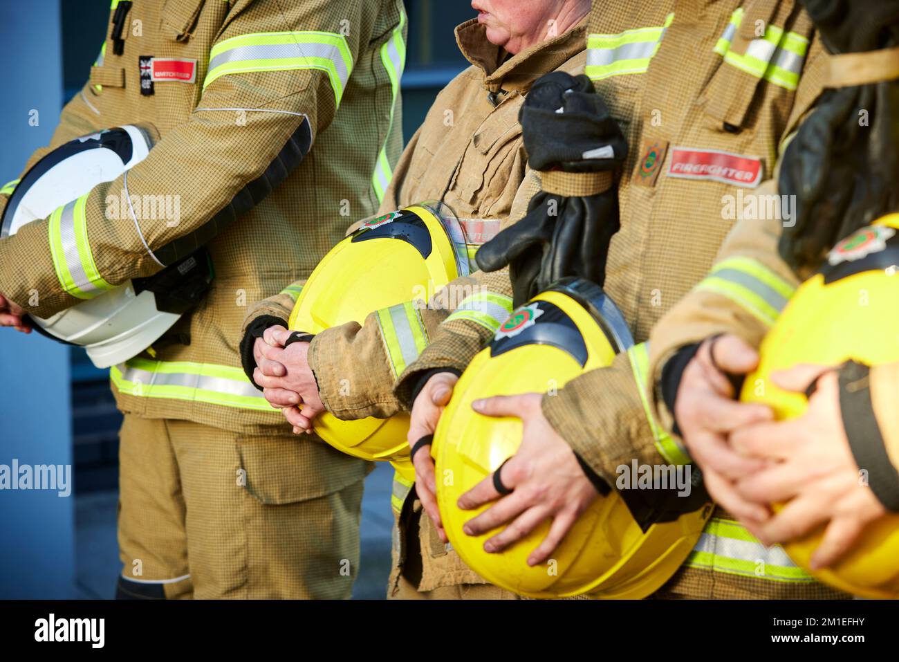 Fireman showing respect holding his helmet Stock Photo