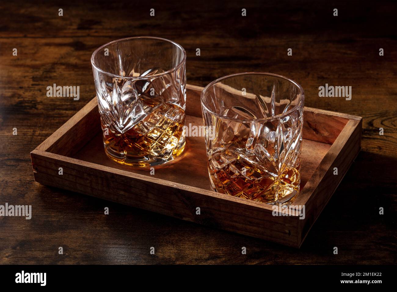 glass of bourbon whisky with ice on the rocks Stock Photo - Alamy