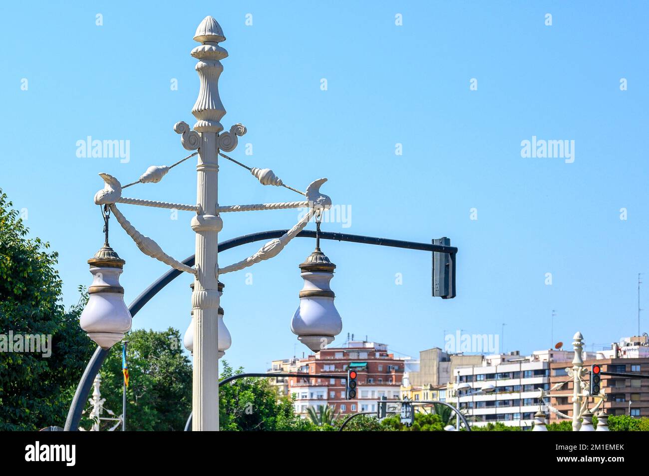 Valencia, Spain July 16, 2022 Old electric lamp intertwined with a