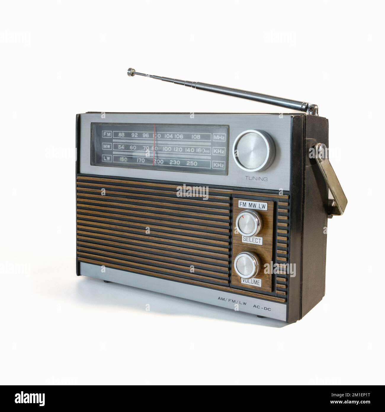 Retro radio receiver from the 70s. Isolated on white background. Traces of time and abrasions on the body Stock Photo
