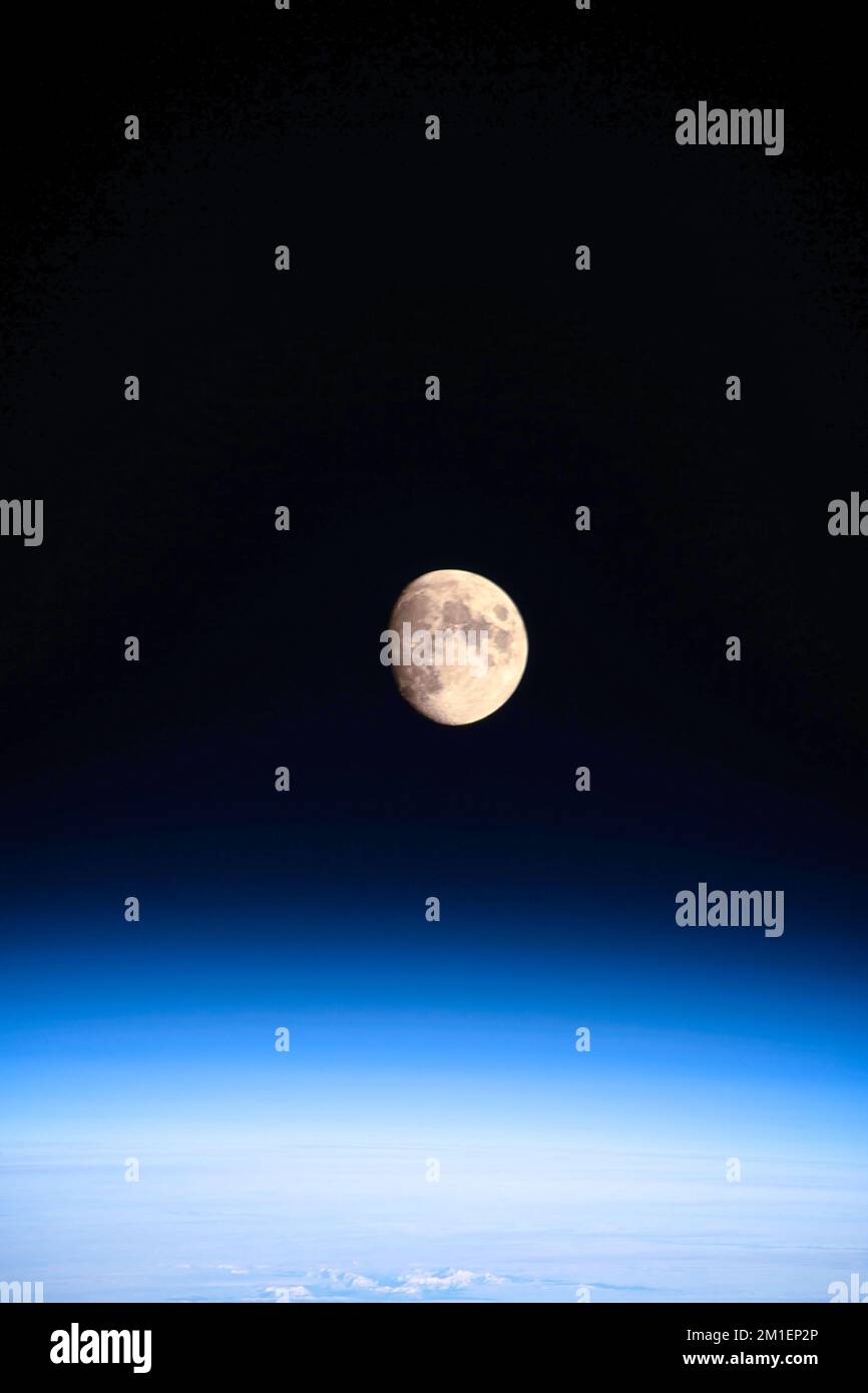 Planet Earth Atmosphere. The moon in the background. Stock Photo