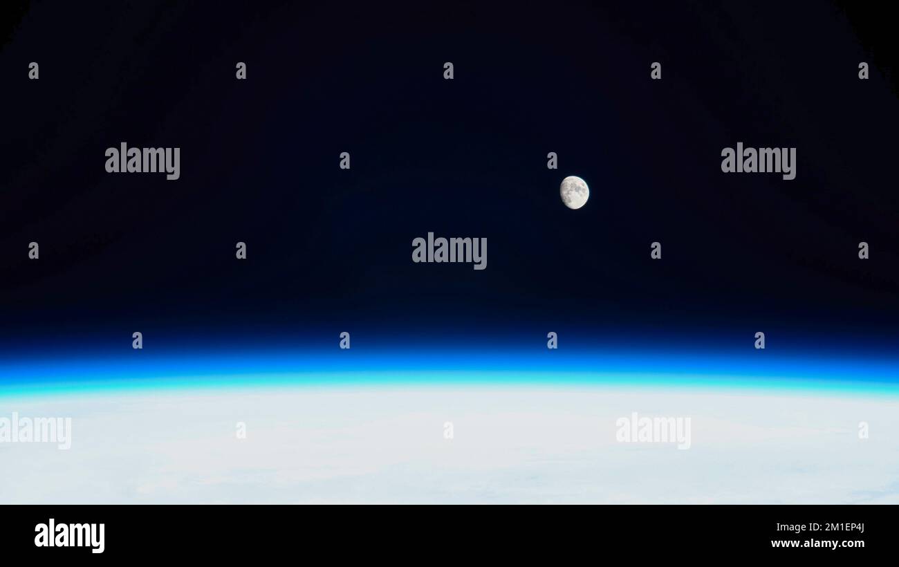Planet Earth Atmosphere. The moon in the background. Stock Photo