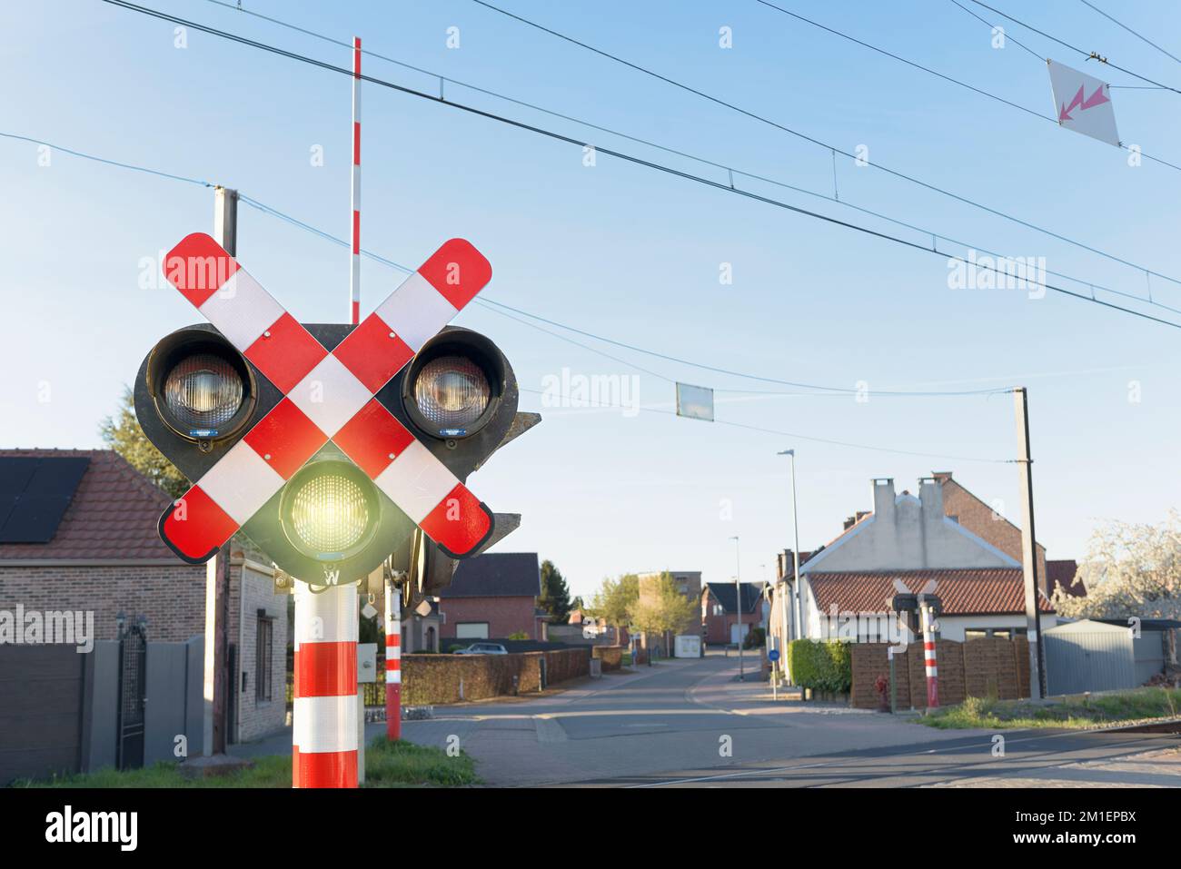 traffic light for the railroad. yellow signal at the crossing. the path is clear for the movement of cars Stock Photo