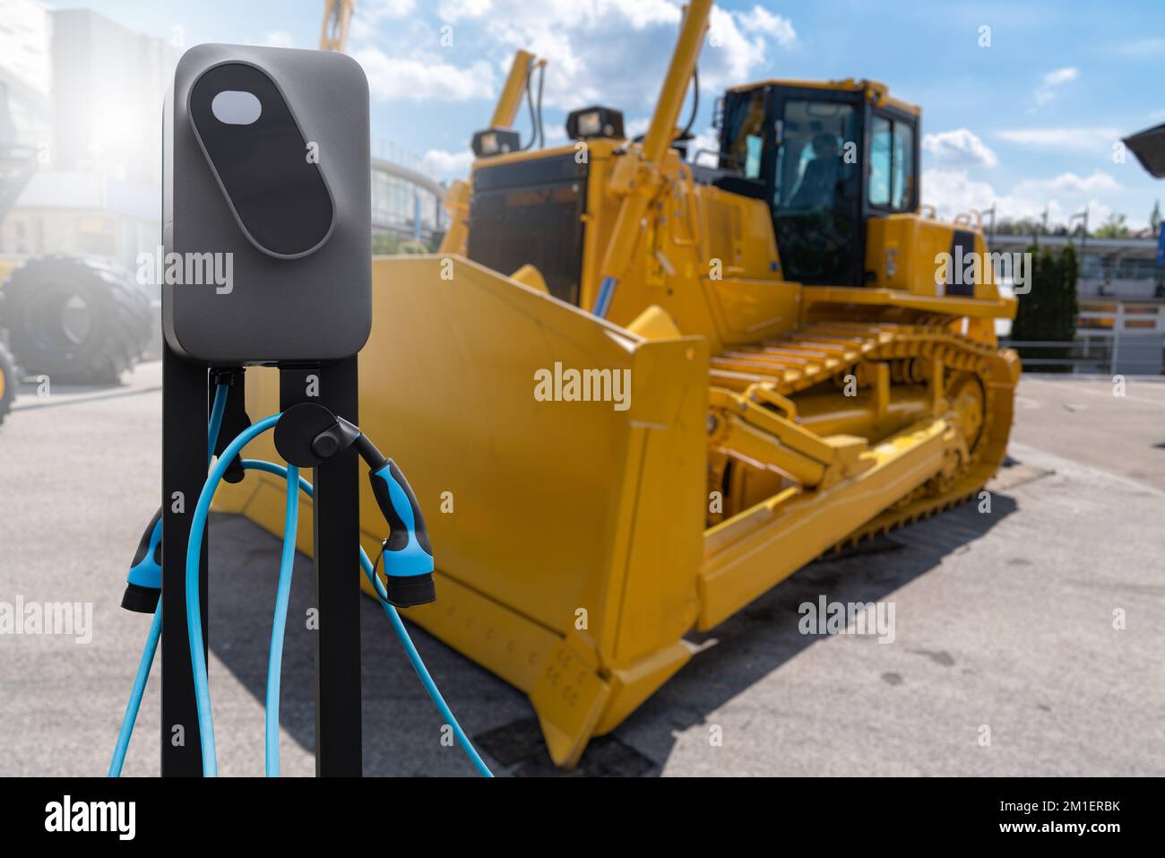 Electric construction machines with charging station. Concept Stock ...