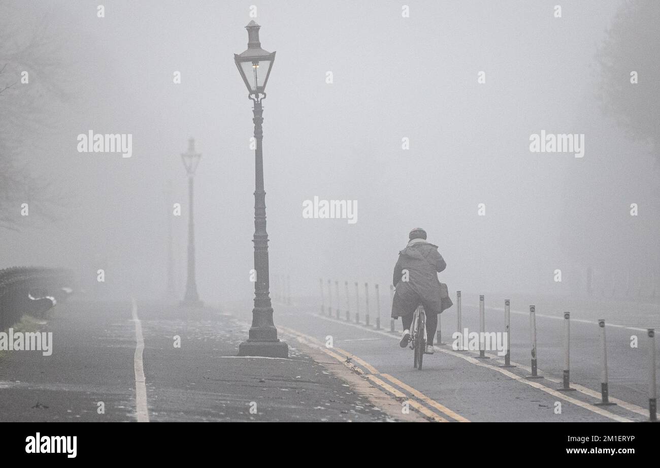 People navigate thick fog in Dublin City as the Irish Met office issued