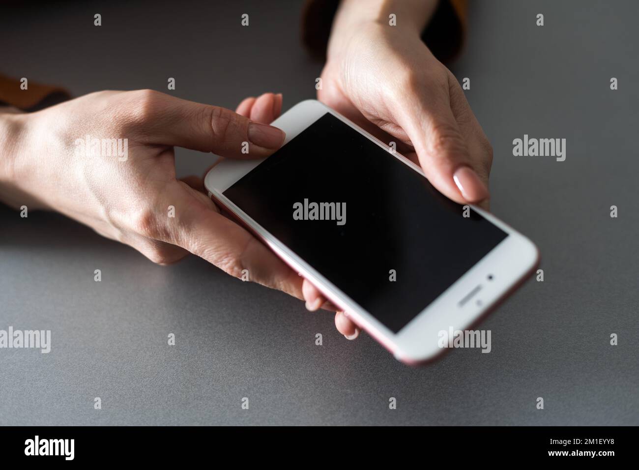 hands holding pressing smartphone buttons Stock Photo