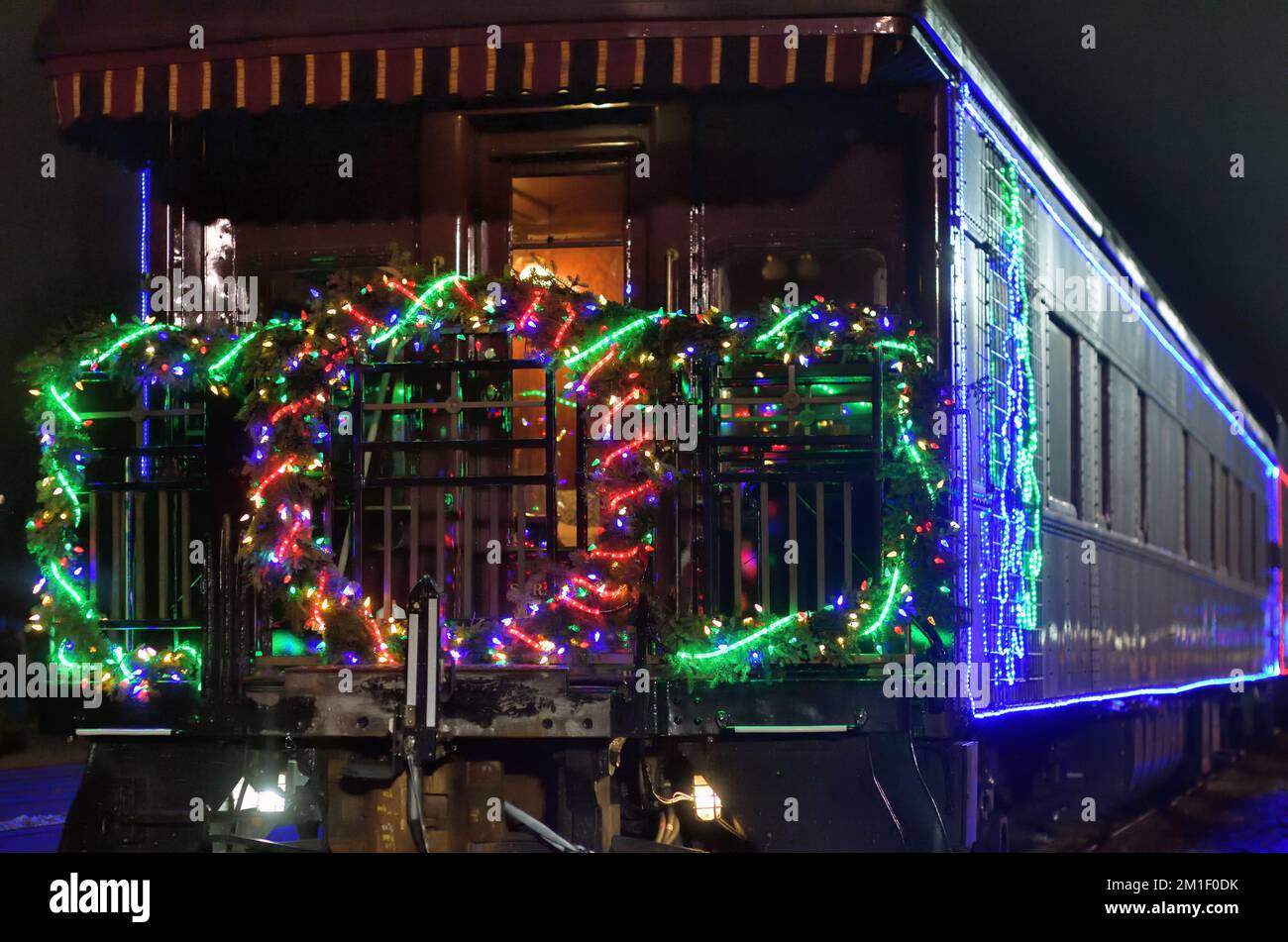 Bensenville, Illinois, USA. Christmas lights on an open platform observation car at the end of the Canadian Pacific Railway Holiday Train. Stock Photo