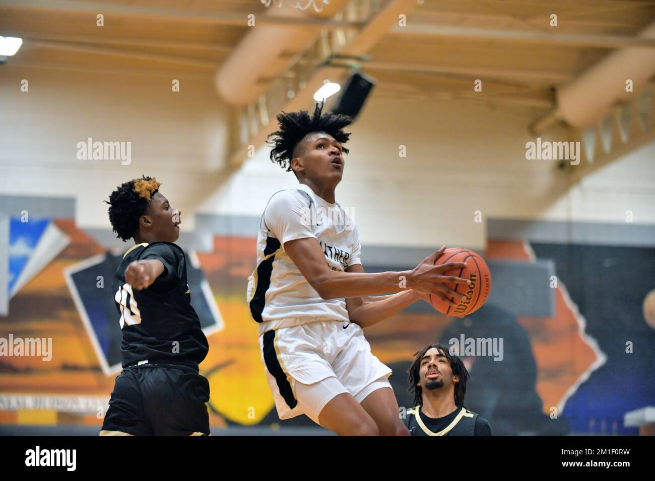 USA. Forward completing a successful drive on the hoop and scoring ...