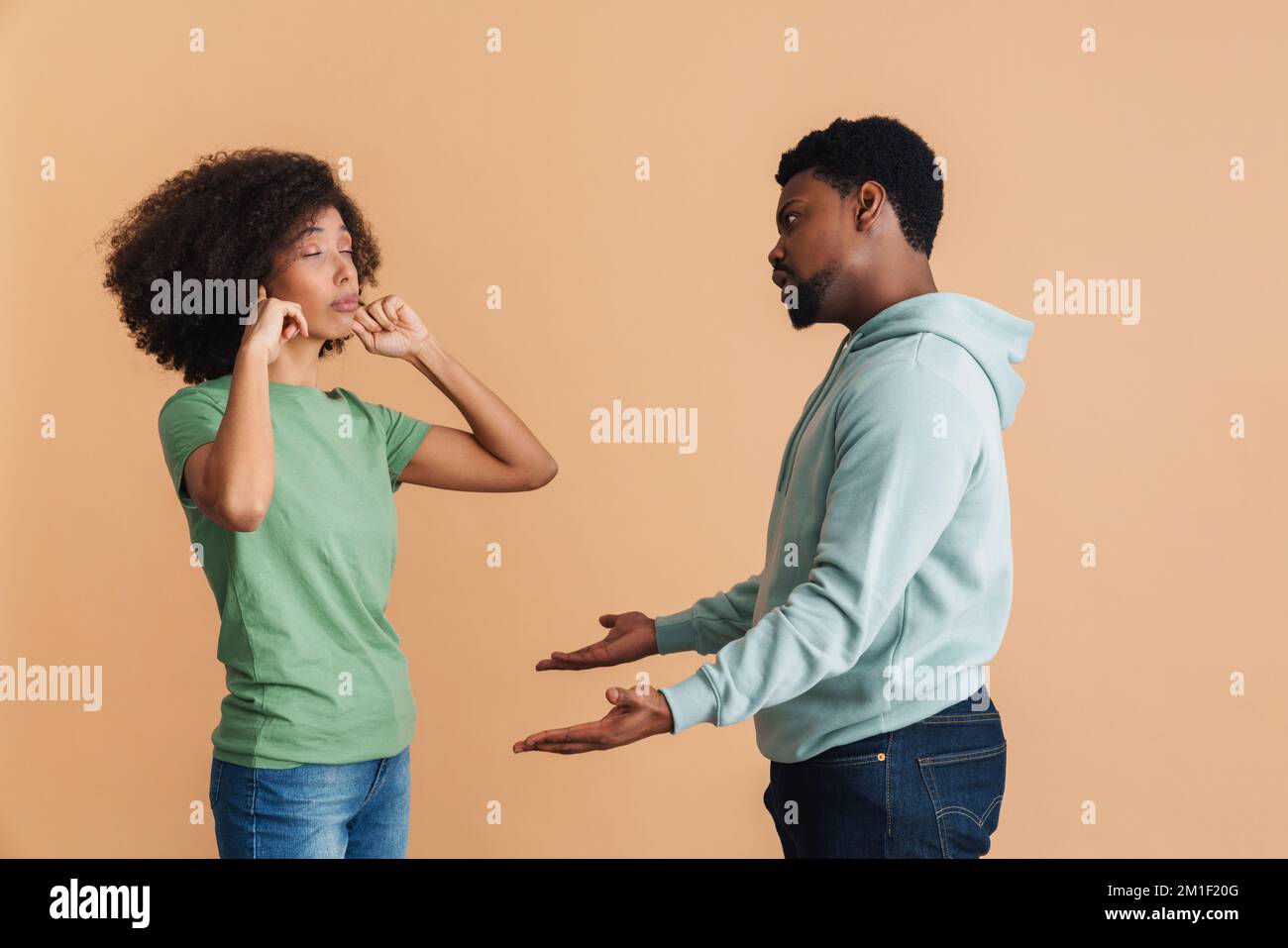 Black man and woman expressing discontent and fighting together ...