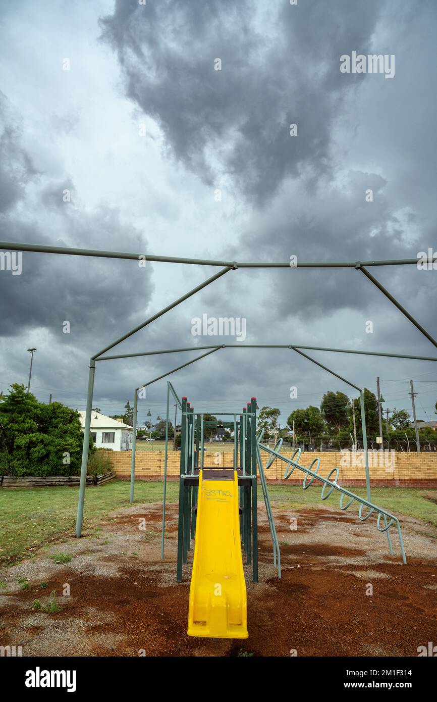 Playground equipment abandoned as a storm system arrives in Tamworth, Australia. Stock Photo