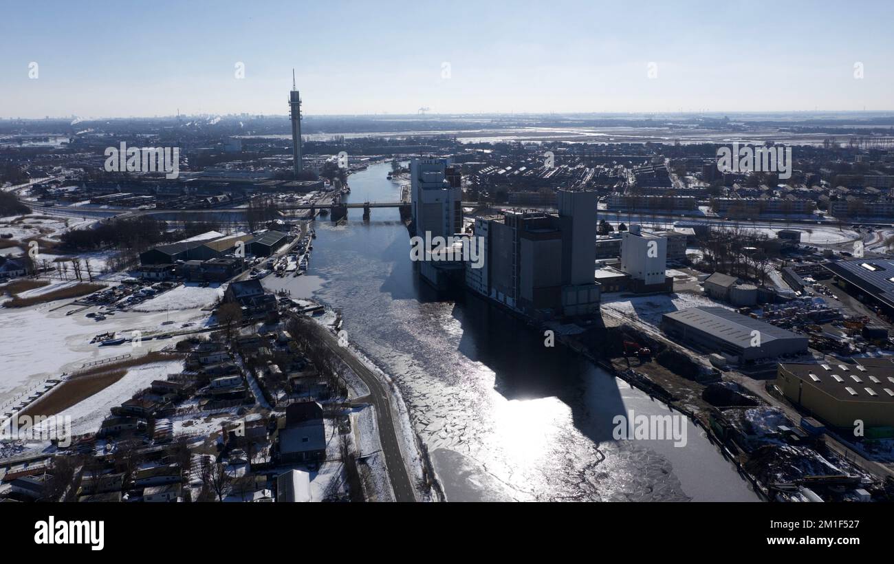 An aerial view of a snowy city with a river Stock Photo - Alamy