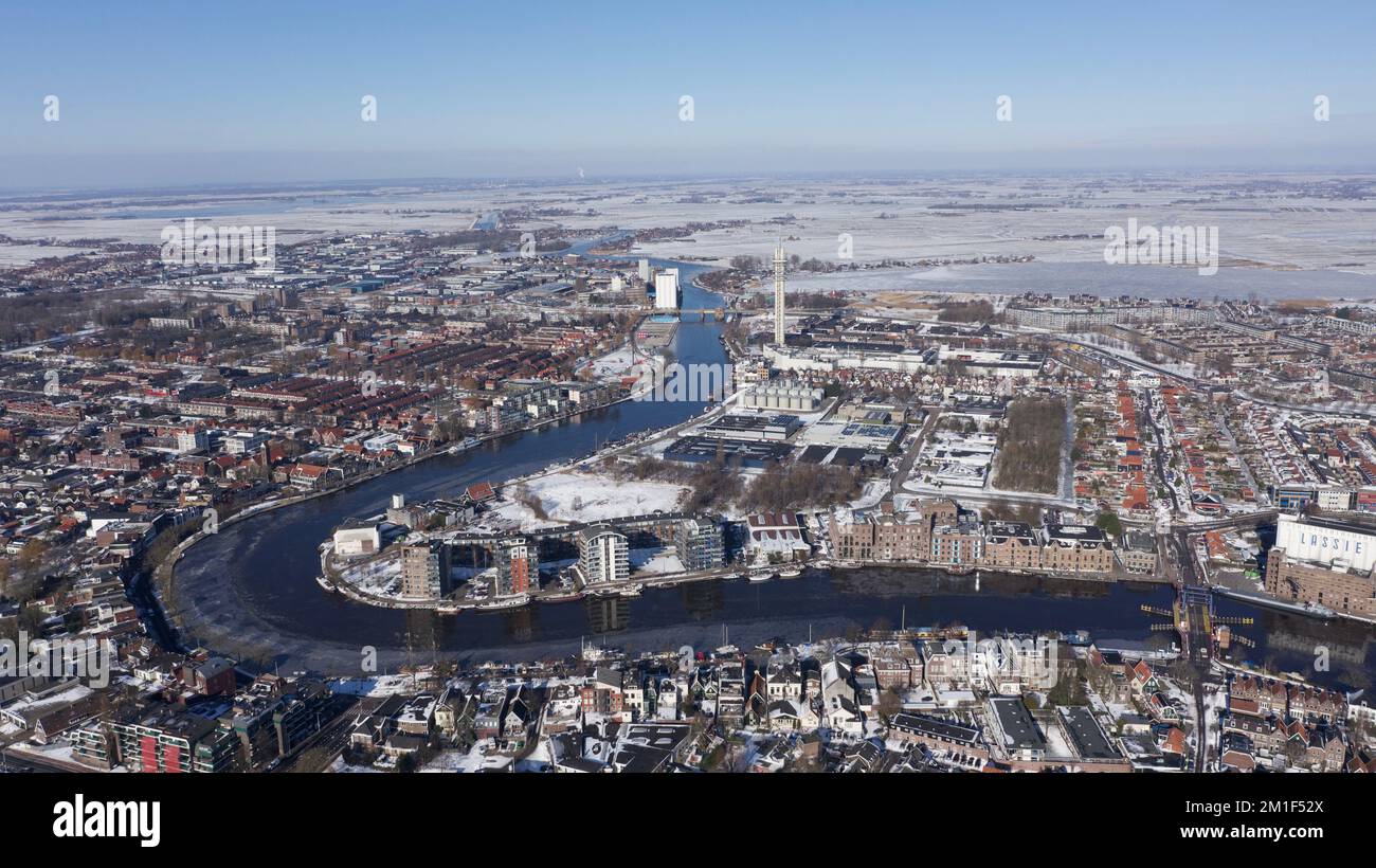 An aerial view of a snowy city with a river Stock Photo - Alamy