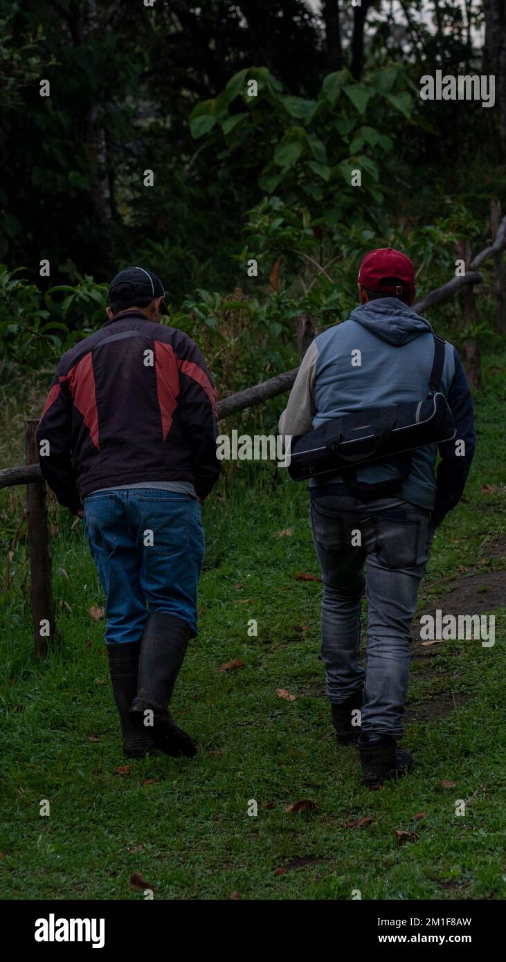 Ecuadorians walking through nature Stock Photo