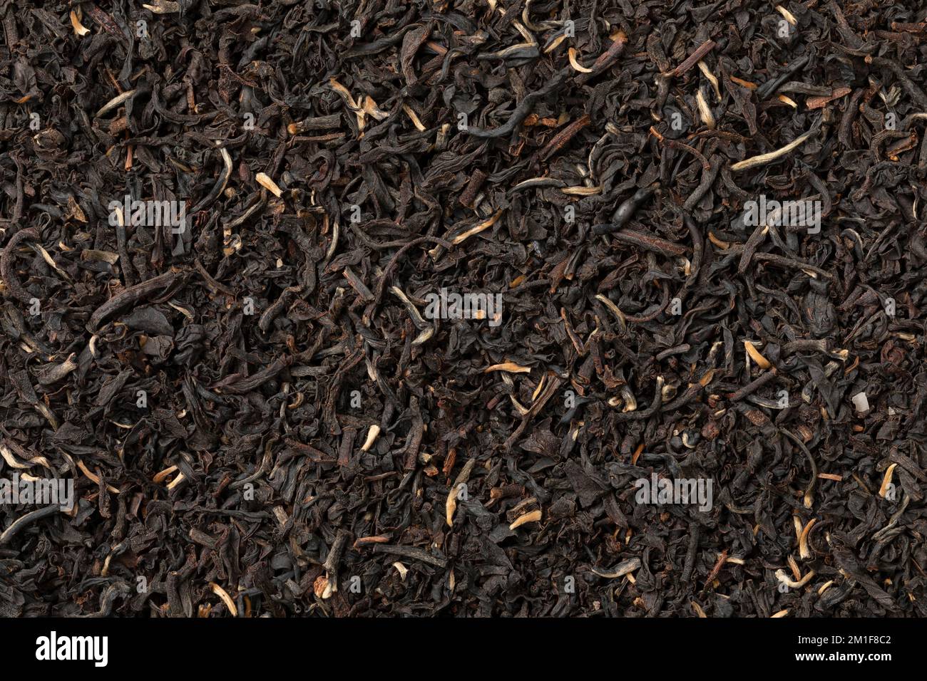 Golden Garden Estate Ceylon dried Tea leaves close up full frame as background Stock Photo