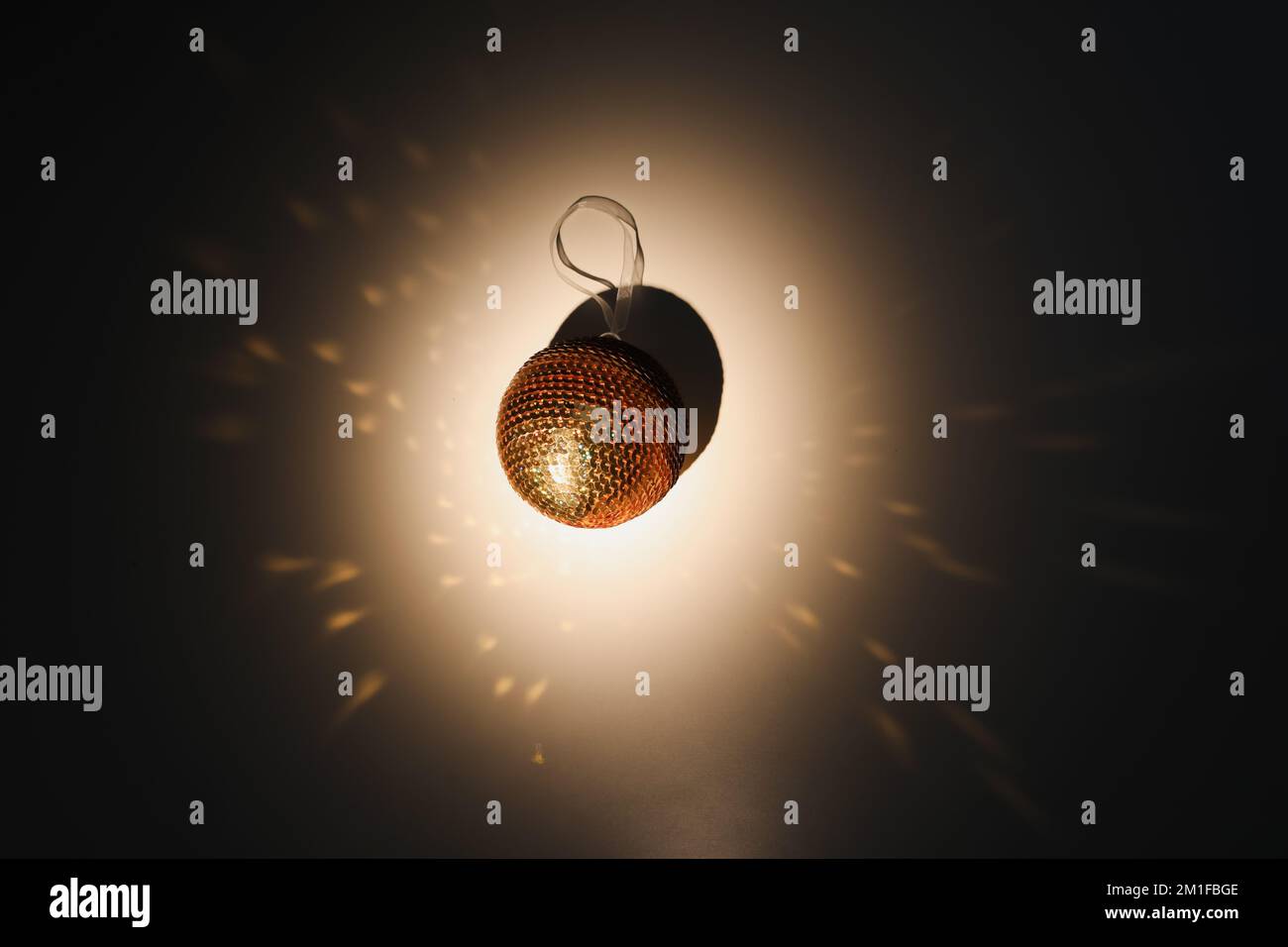 Colorful Christmas ball and sparkles on white background, top view