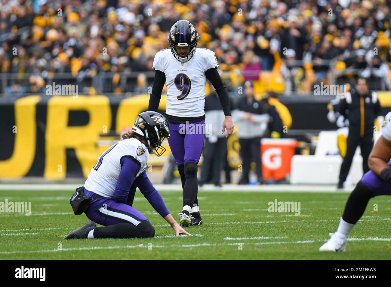 Levi's Stadium turf slides under Ravens kicker Justin Tucker's