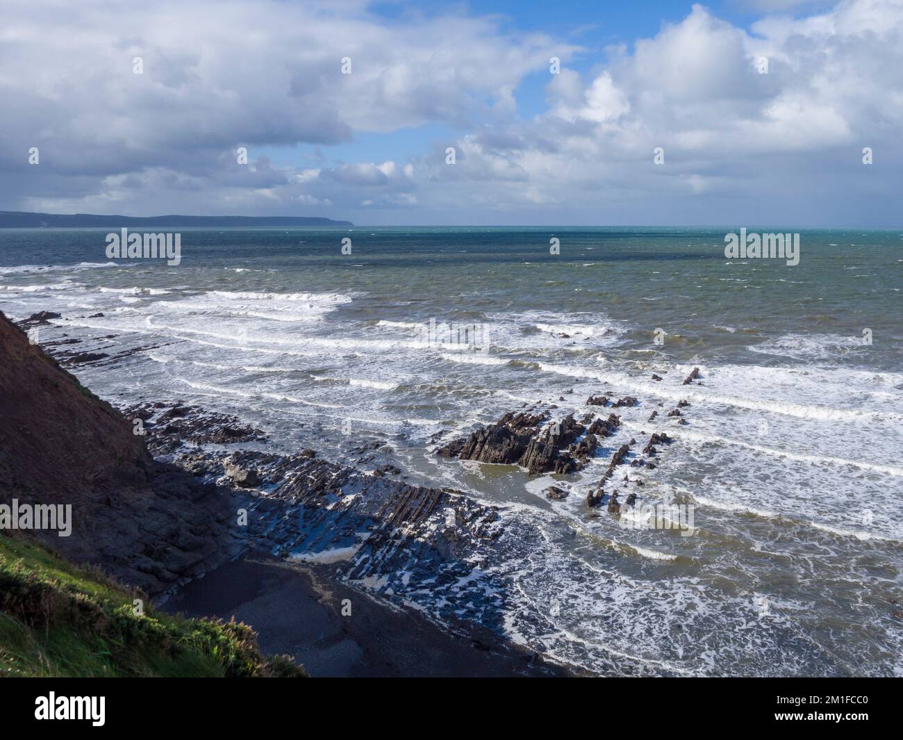 Bideford Bay from the cliffs at Westward Ho! with Hartland Point beyond, North Devon, England. Stock Photo