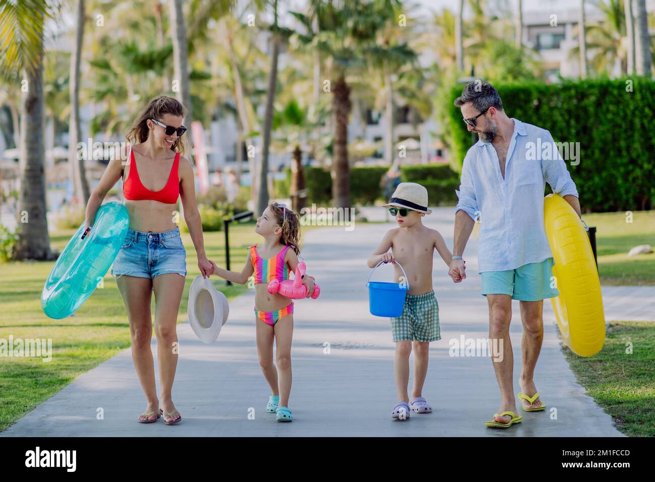 Happy family with little kids enjoying time at holiday in exotic country. Stock Photo