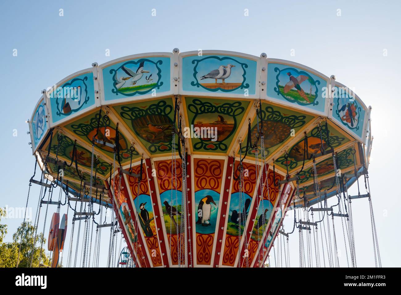 Helsinki, Finland - 24 June 2022: Ride chain carousel Ketjukaruselli in amusement park Linnanmaki Stock Photo