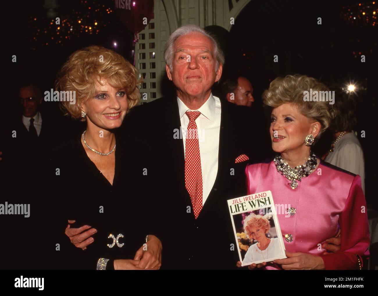 Jill Ireland with Sidney Sheldon and Judith Krantz at the party ...