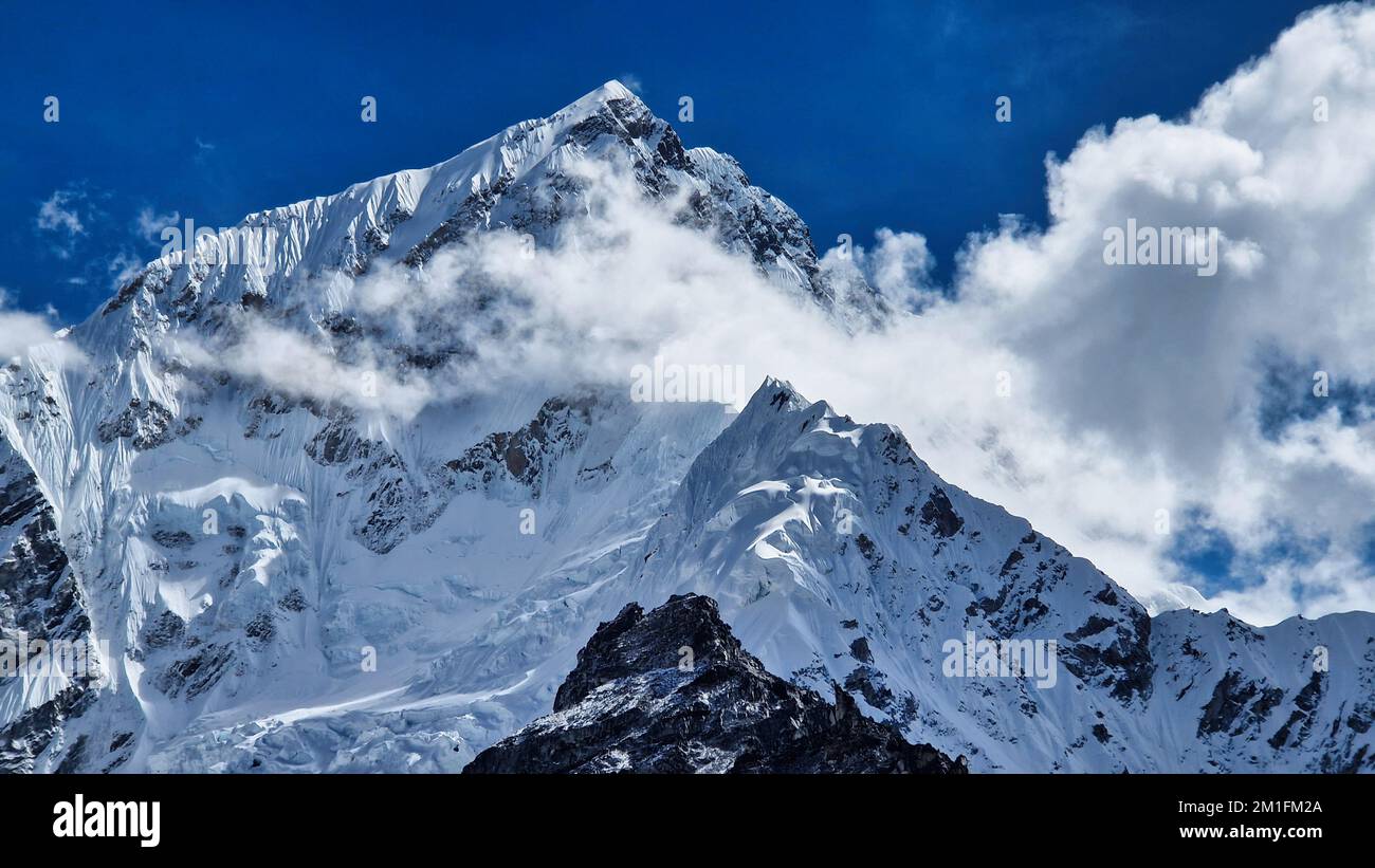 epic glacier massif with two peaks and clouds in front Stock Photo