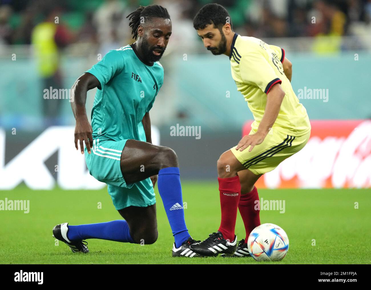 Team A's Johan Djourou (left) in action during a Workers and FIFA Legends Match at the Al Thumama Stadium, Doha, Qatar. Picture date: Monday December 12, 2022. Stock Photo