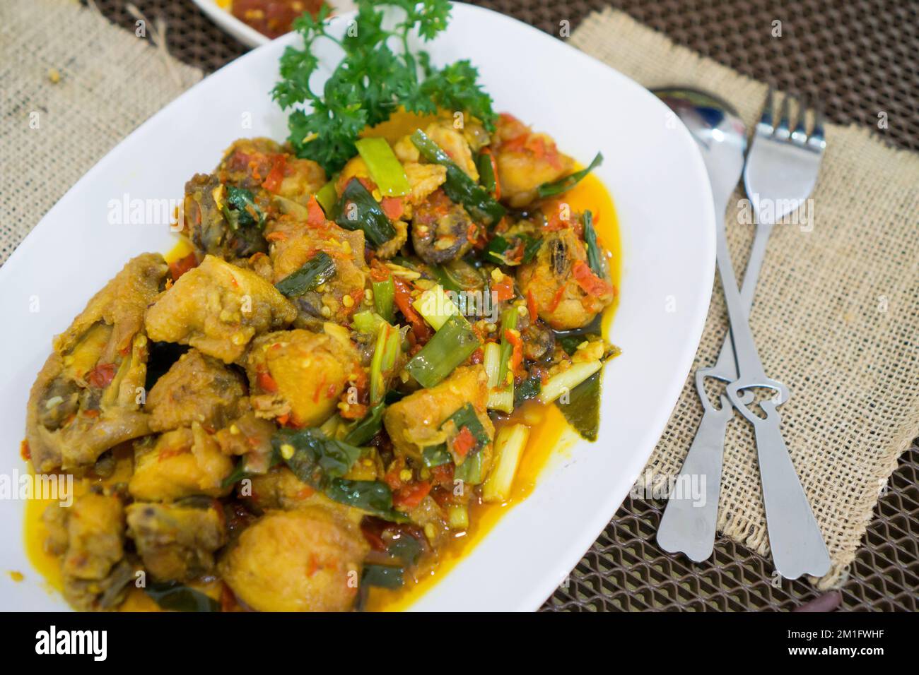 Ayam rica-rica is traditional food from Manado Indonesia chicken with spicy seasoning Stock Photo