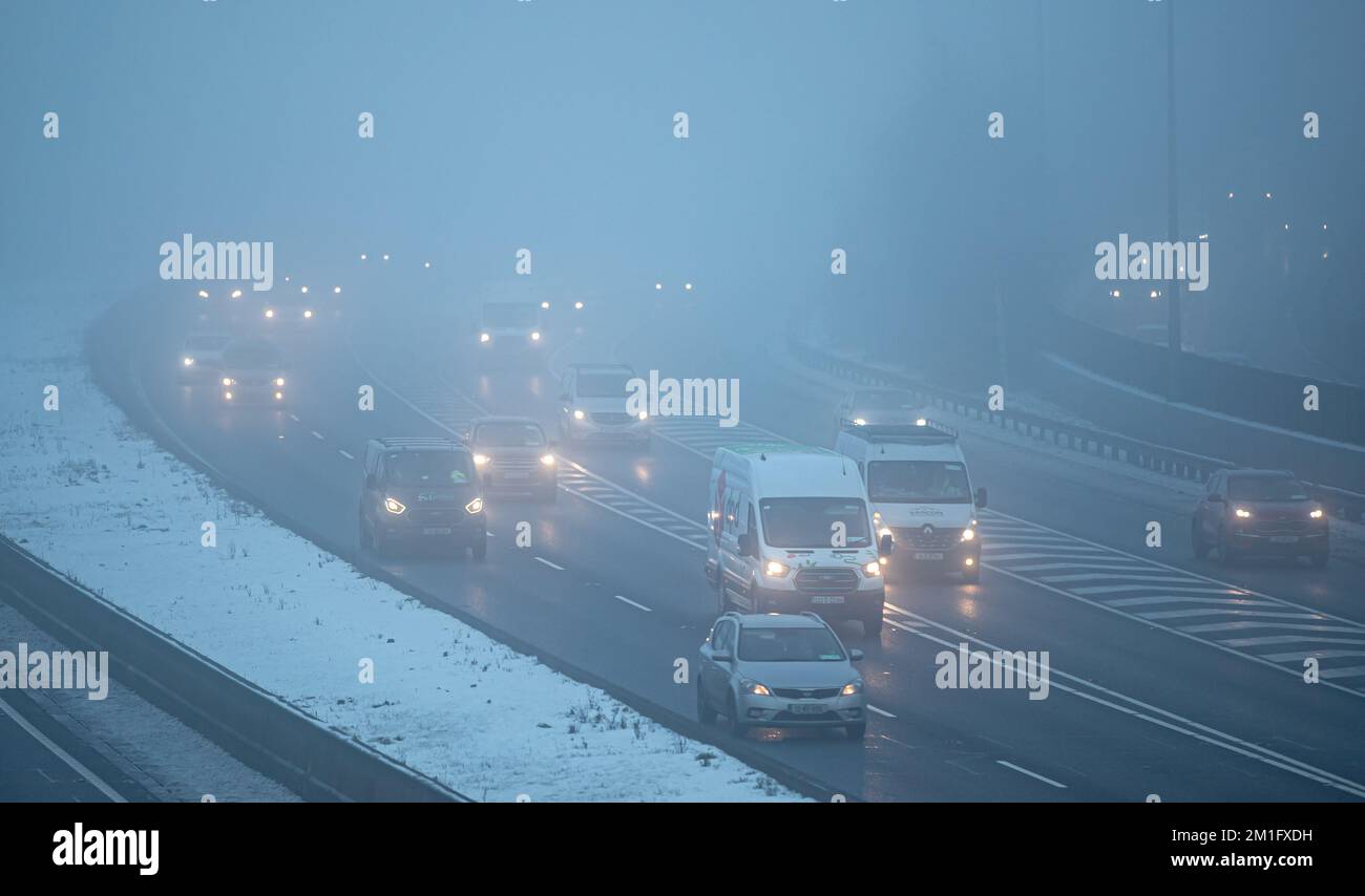 Commuters drive in freezing fog on the M50 motorway in Dublin during