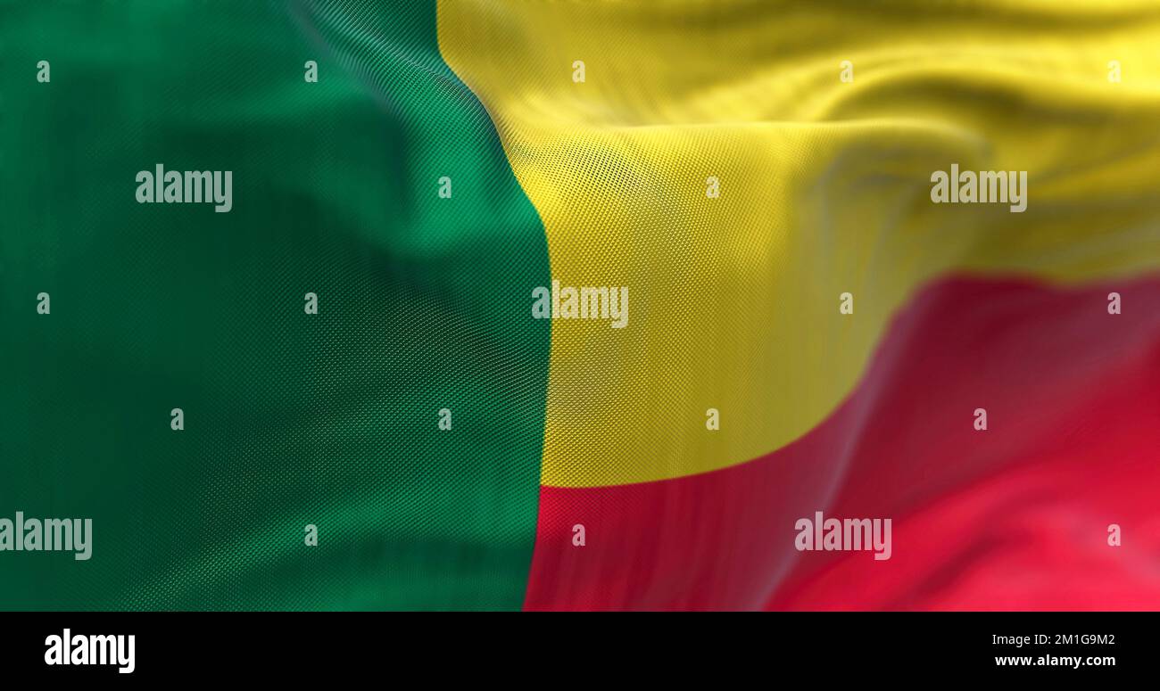 Close-up view of the Benin national flag waving. The Republic of Benin is a country in West Africa. Fabric textured background. Selective focus Stock Photo
