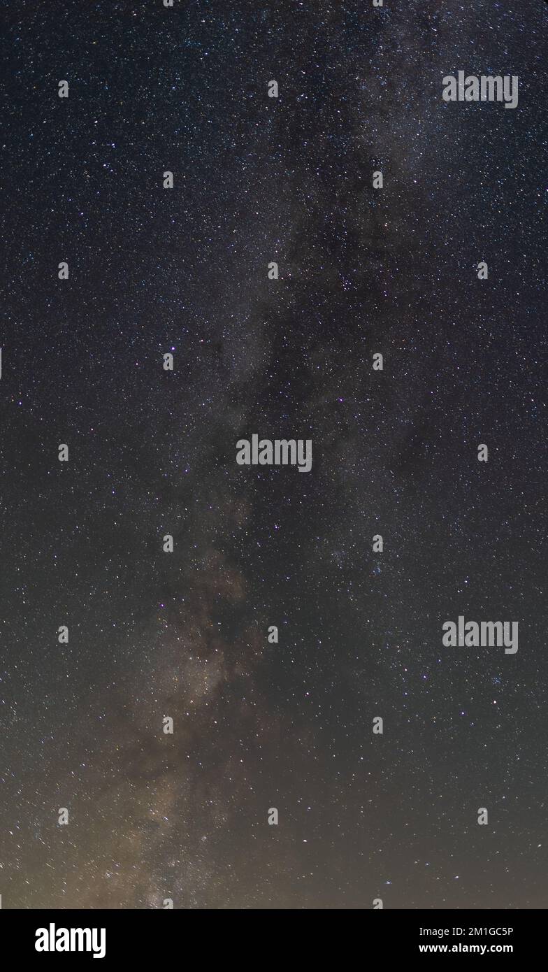 A vertical shot of the starry night Stock Photo - Alamy