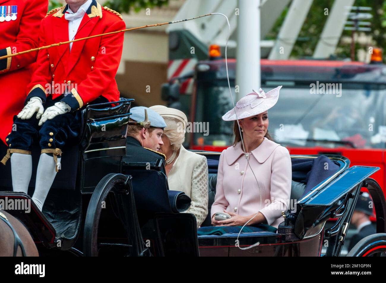Prince Harry in uniform, with Kate, Duchess of Cambridge, and Camilla, Duchess of Cornwall, Trooping the Colour 2013 in The Mall, London, UK Stock Photo