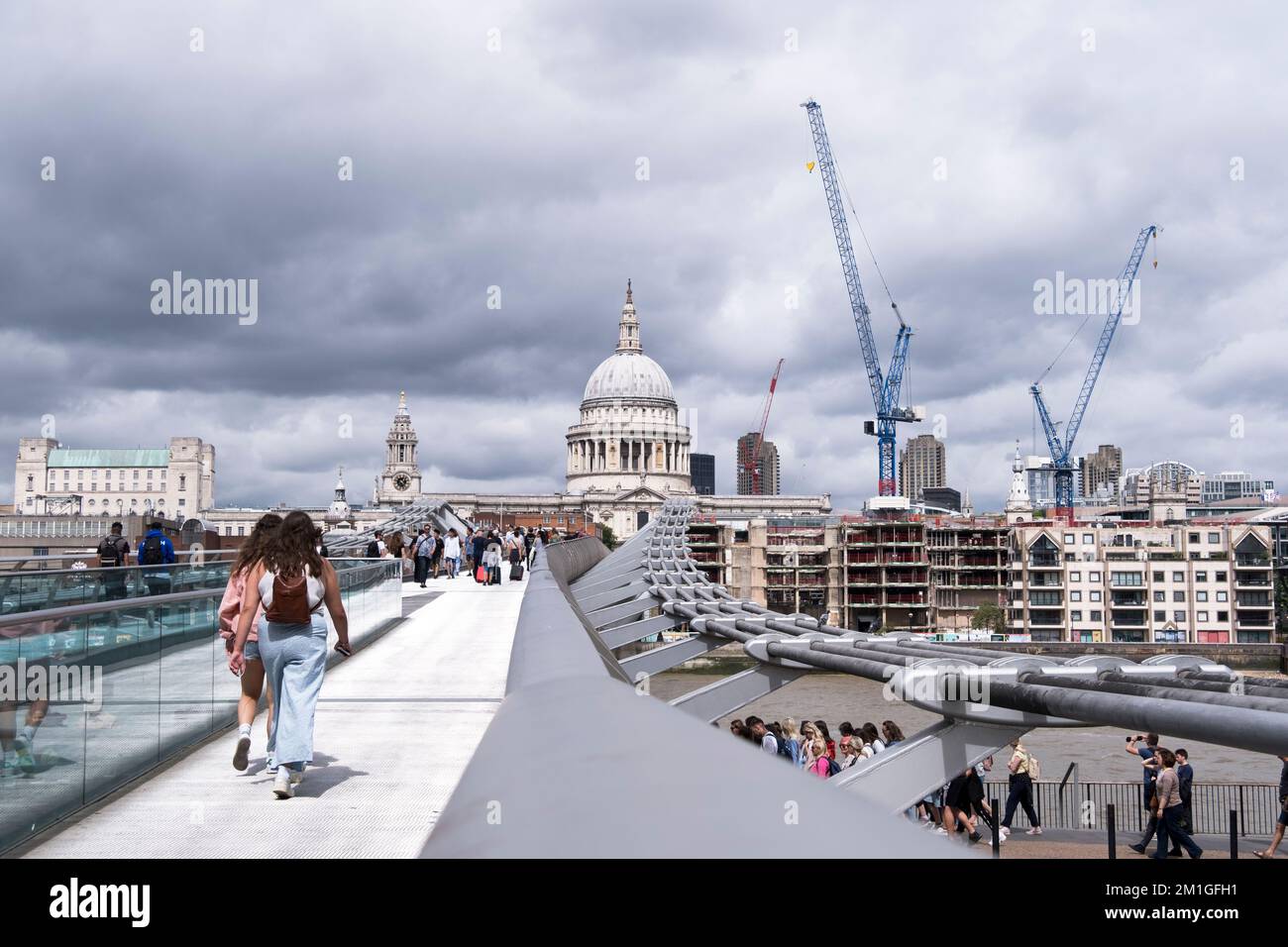 View along the Millennium Bridge towards St Paul's Cathedral in London. Stock Photo