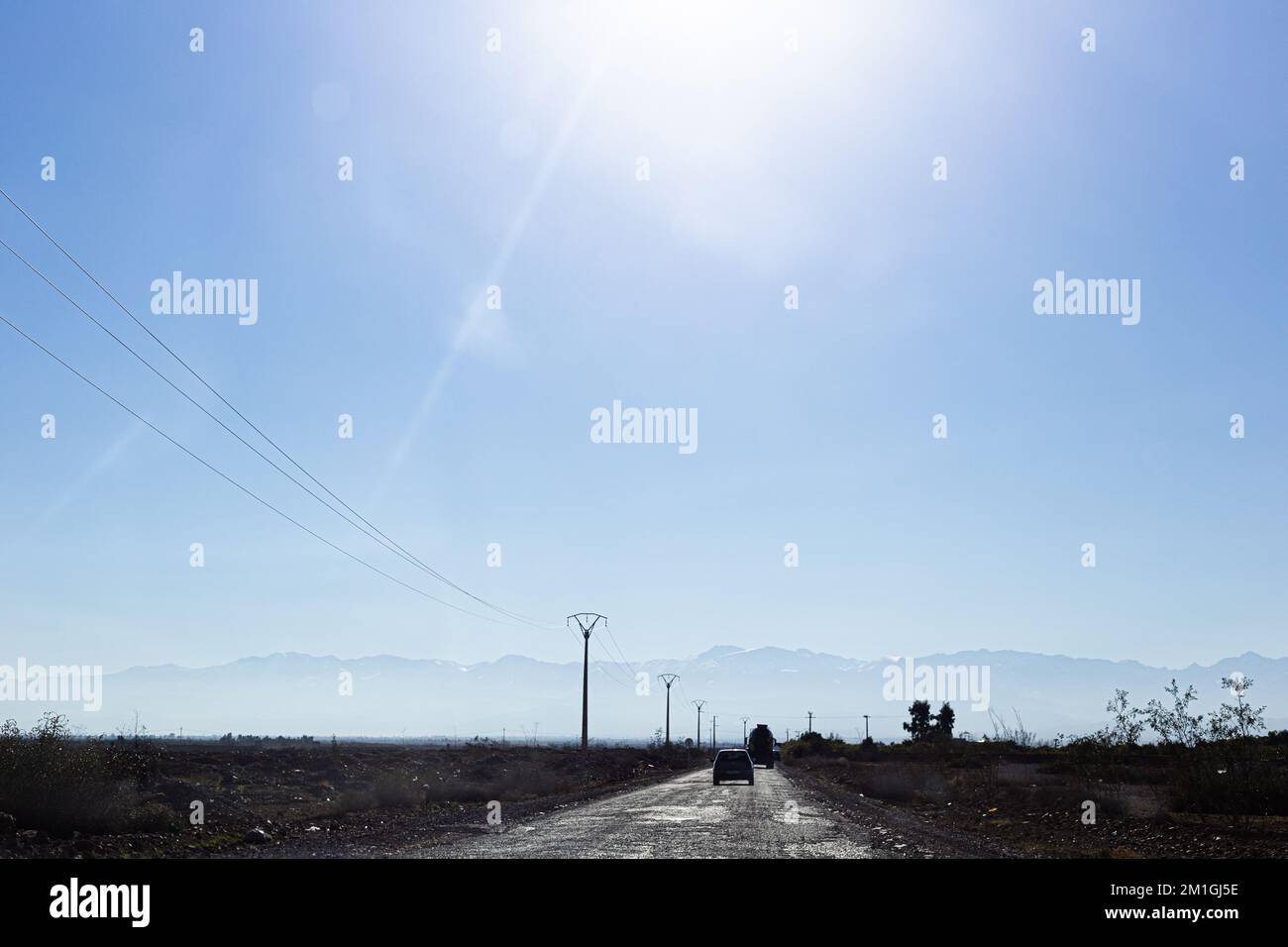 Destroyed Rural Road Rural road destroyed in the middle of high voltage pylons Stock Photo ...