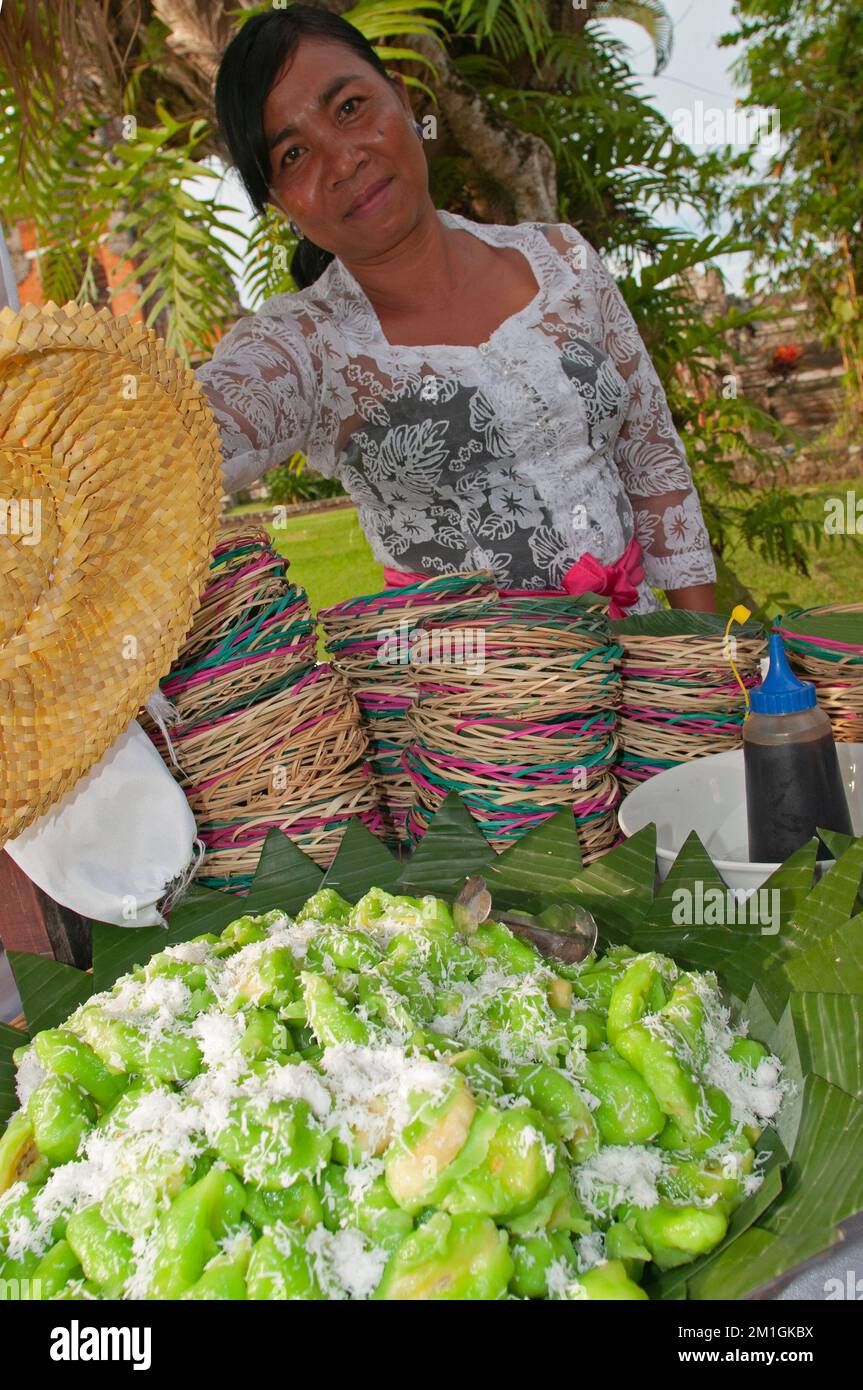 Bali, Indonesia,29-11-2012-Woman is selling green indonesian sweets. Stock Photo