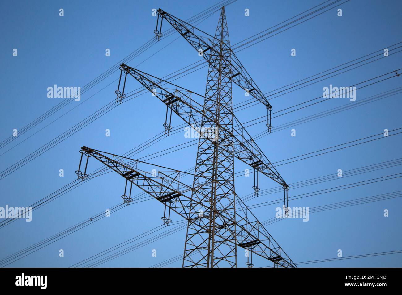 Power line in front of a beautiful evening sky Stock Photo - Alamy