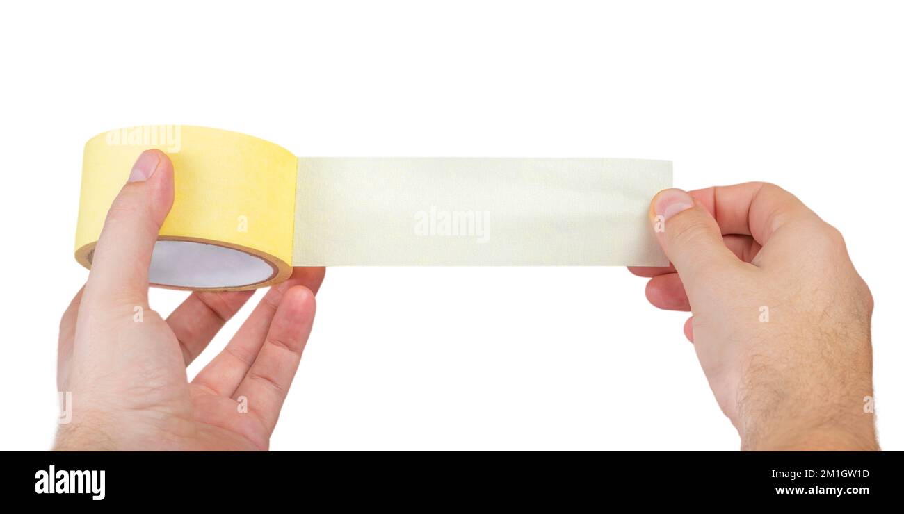Paper adhesive tape isolated on white. A roll of paper duct tape in the hands of a white man