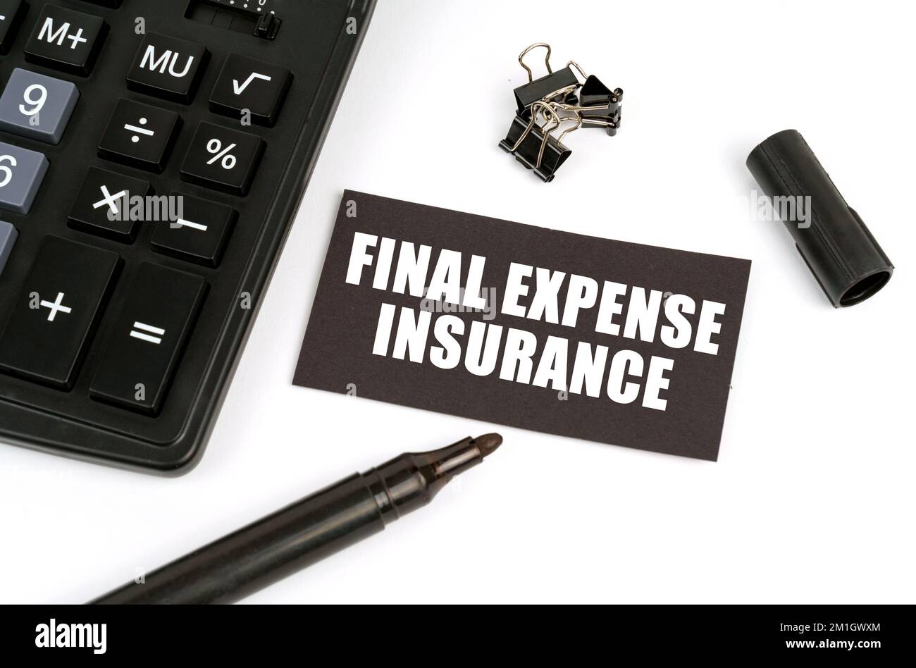 Business and finance concept. On a white table there is a calculator, a