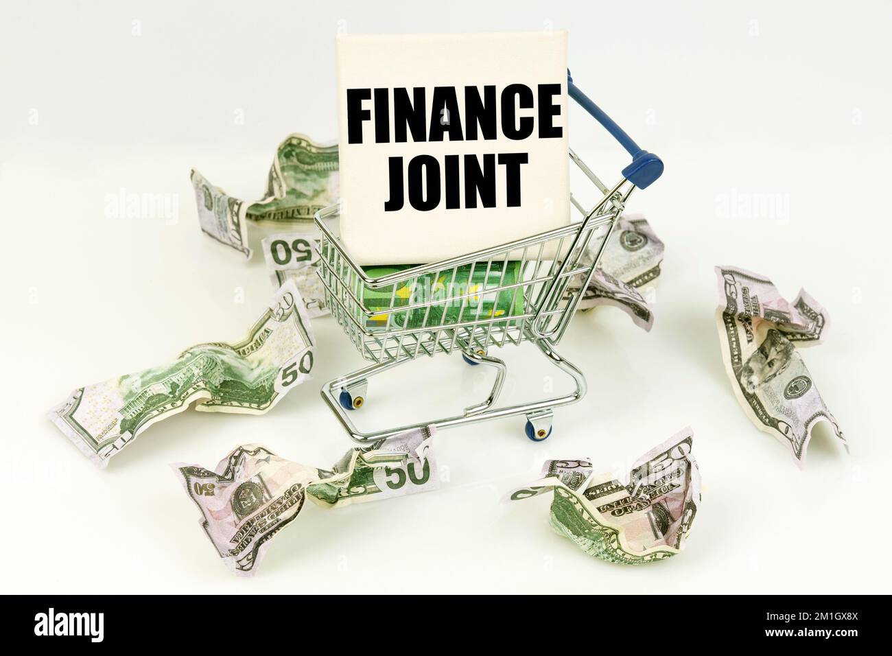 Business and economy concept. Crumpled dollars lie on a white surface ...