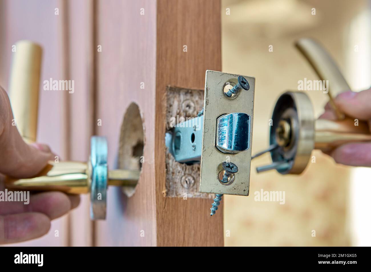Fixing faulty lever doorhandle with latch on an interior door Stock Photo Alamy