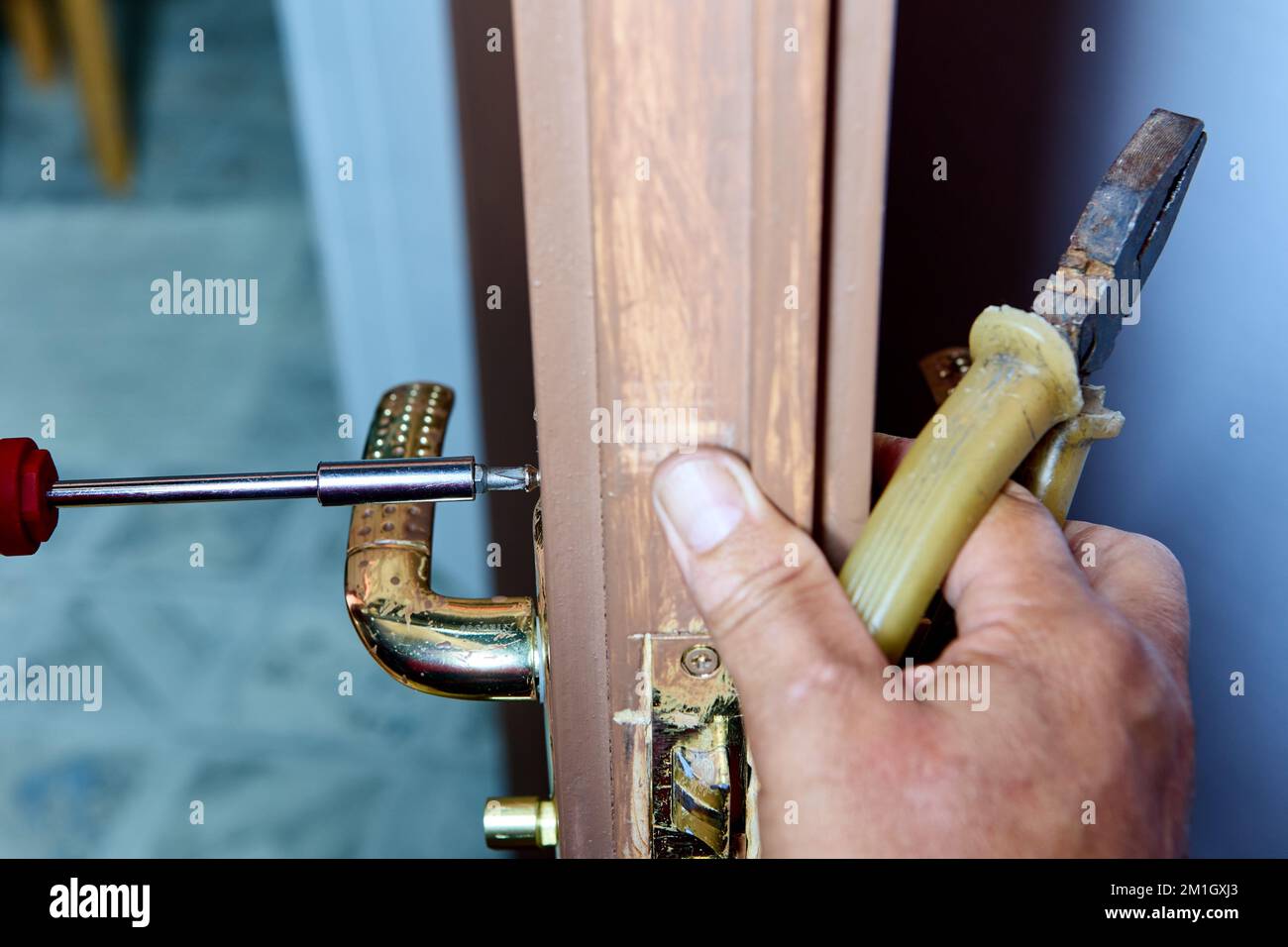 Repair of faulty lever door handle in interior door Stock Photo Alamy