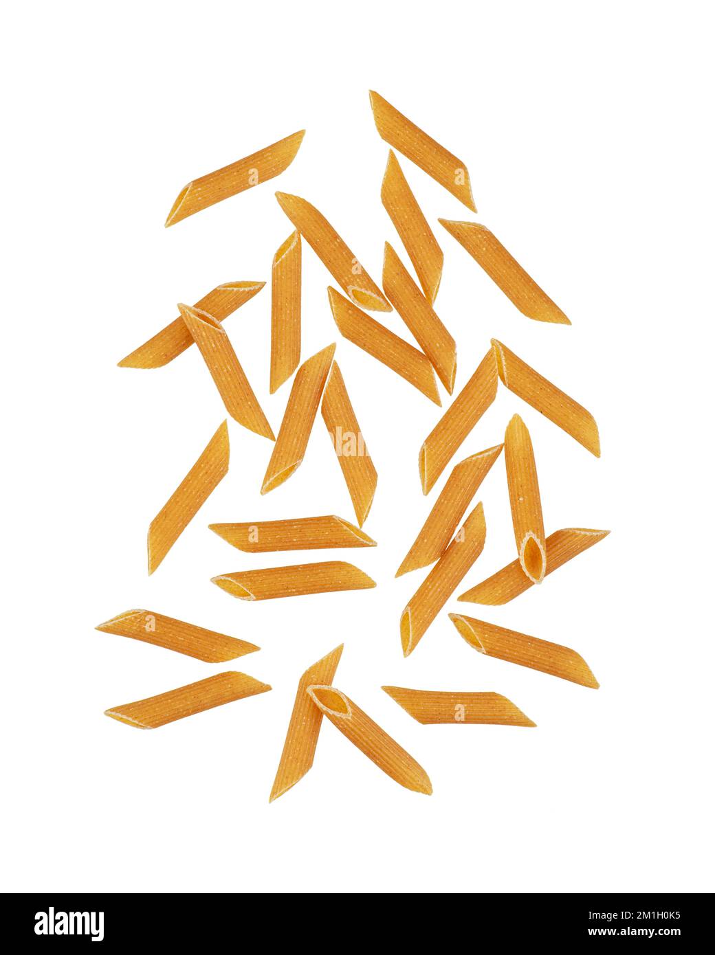 Whole grain pasta falling on a white background. Levitation. Stock Photo
