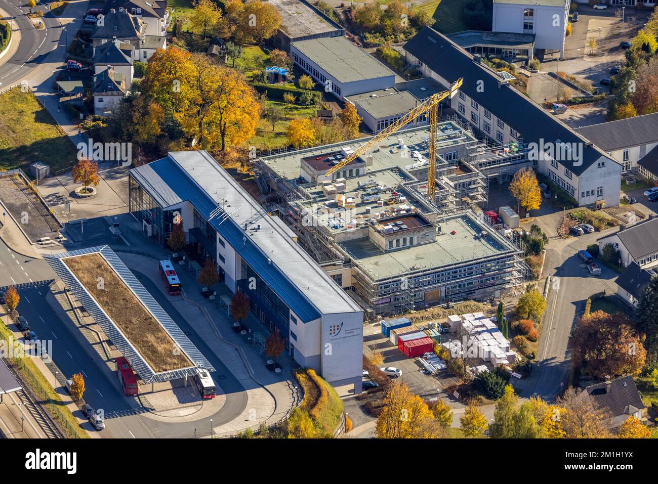 Aerial view, bus station and construction work at the Berufskolleg Olsberg of the HSK in Olsberg, Sauerland, North Rhine-Westphalia, Germany, Construc Stock Photo