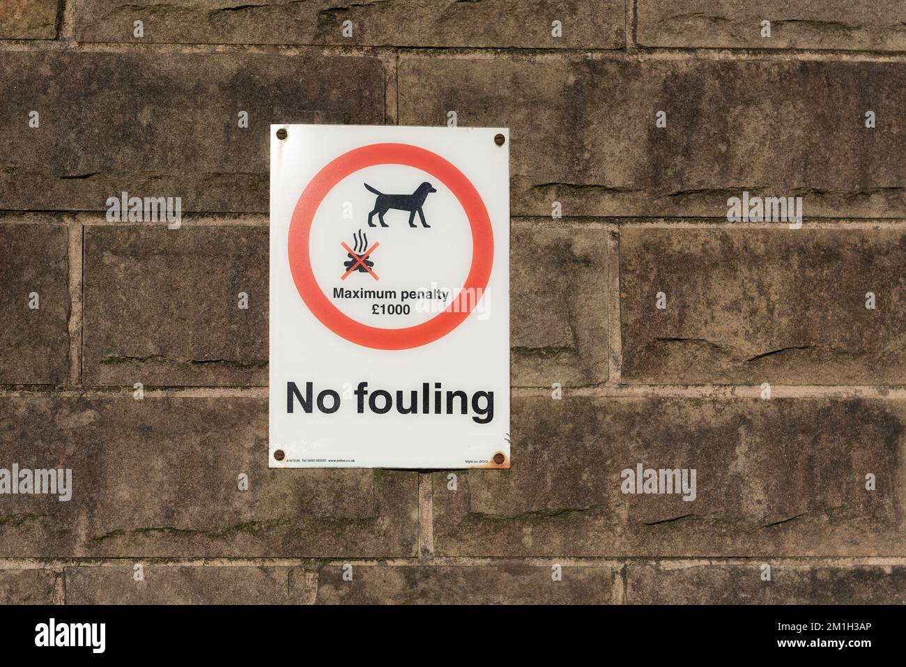 Taken in Rossendale Lancashire on 11 December 2022. Council sign warning dog walkers to pick up dog foul. Stock Photo