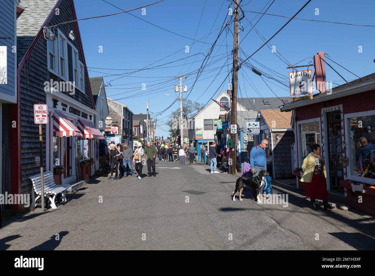People stroll around the unique shops and boutiques on Bearskin Neck in