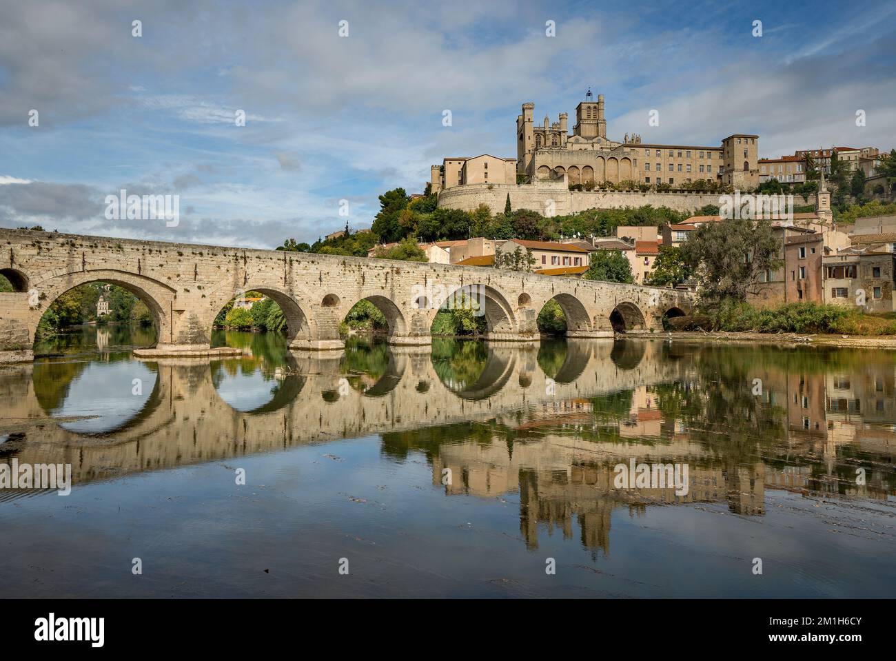 View of the Pont vieux and the cathedral Saint-Nazaire from river Orb in Béziers, Herault, France. Stock Photo