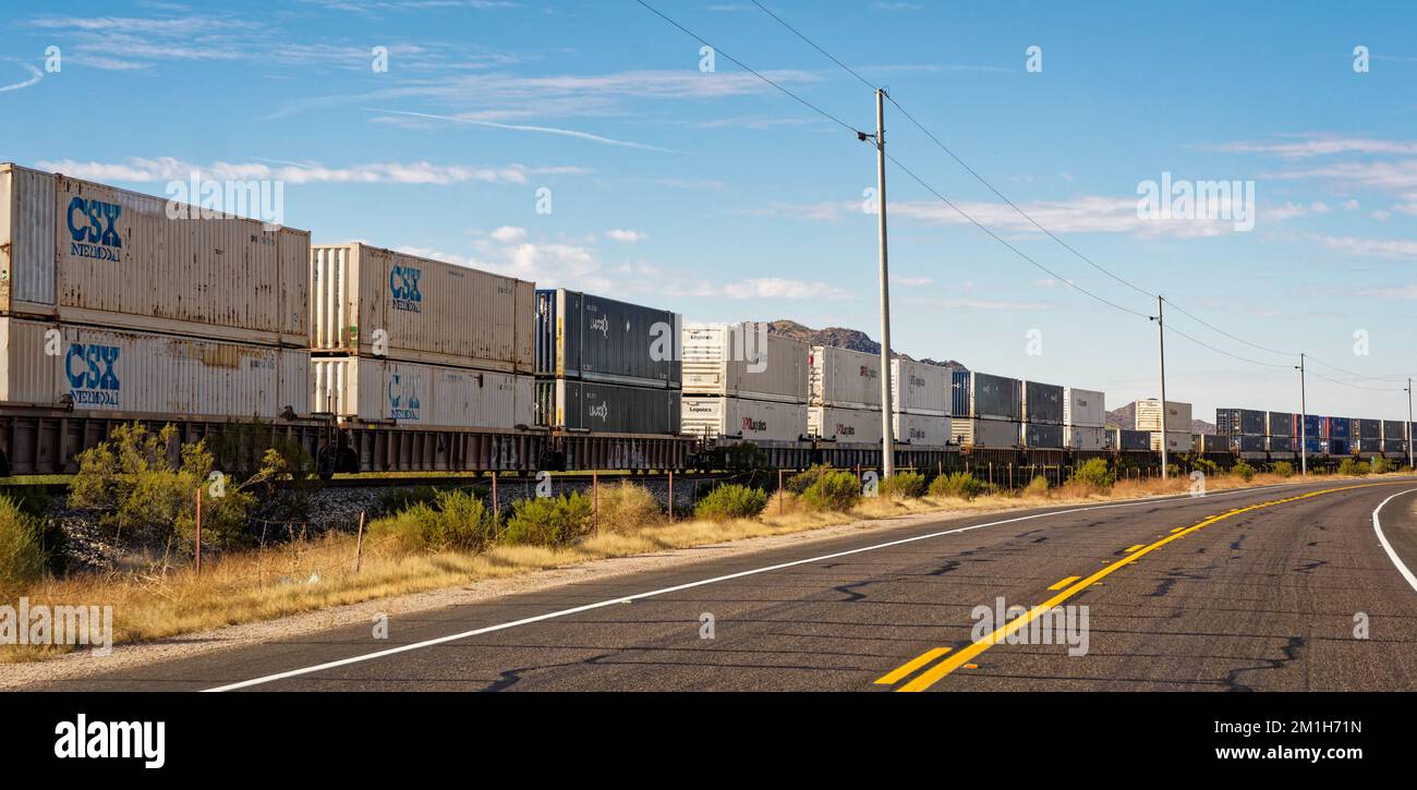 Shawmut, AZ - Nov. 28, 2022: Freight train with shipping containers on the Union Pacific Railroad's Sunset Route which travels beside W Maricopa Road, Stock Photo