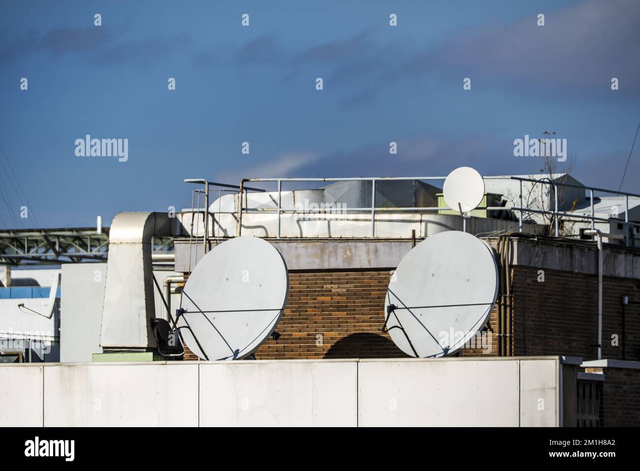Rooftops of the city with smoke outlets, ducted air conditioning