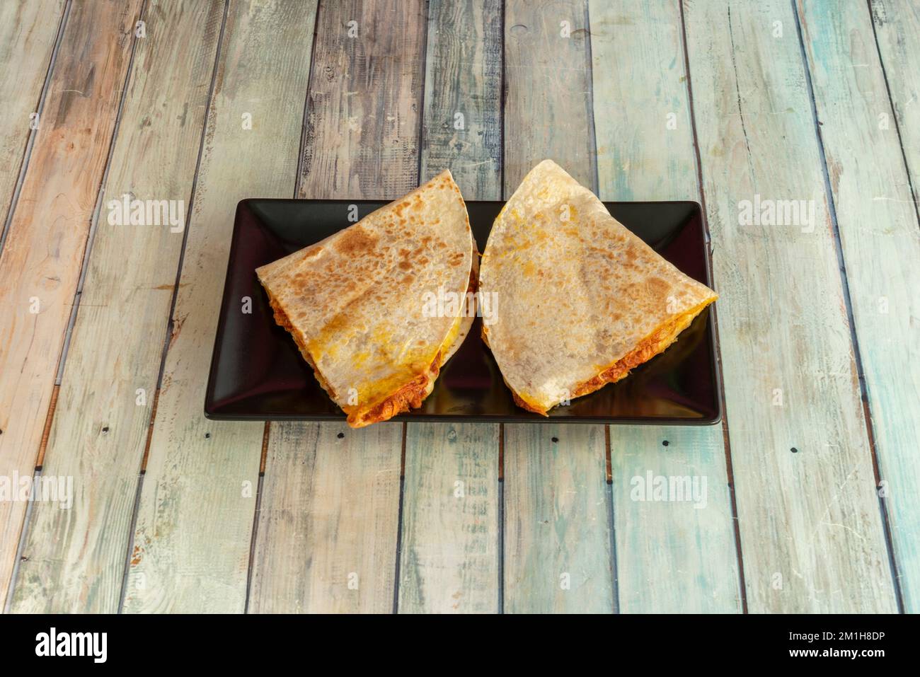 The quesadilla is a Mexican dish that consists of a corn or wheat
